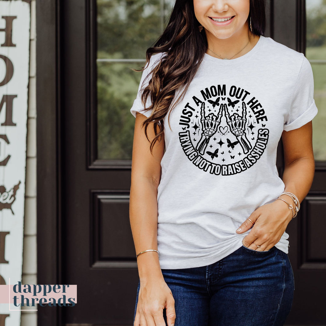 Just A Mom Out Here Trying Not To Raise Assholes Tee